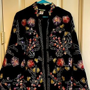 A 220 Hickory ornate thread loop patterns in soft colors on the black M jacket